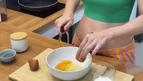 woman preparing eggs