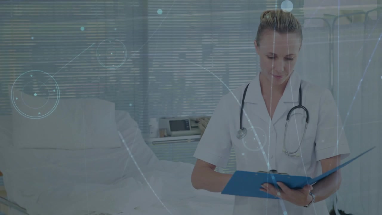Female Doctor Reviewing Medical Records in Hospital Room