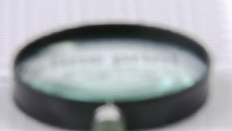 Blurred magnifying glass getting sharp
