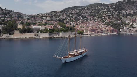 Breathtaking-Barque-Sailing-Yacht-on-Cote-d'Azur,-Mediterranean-French-Riviera-Coastline---Aerial-Orbit