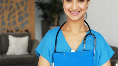 Portrait-of-female-doctor-holding-a-clipboard