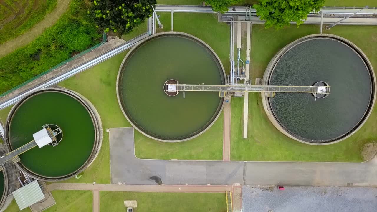 Aerial view of circular water treatment tank for cleaning up and recycling the contaminated wastewater from industrial estate usage
