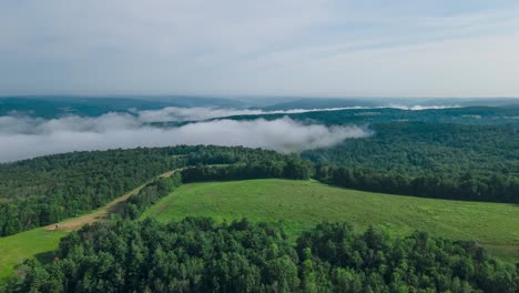 Drone-hyperlapse-of-fog-rolling-over-the-fields-and-forest-of-Owego-in-Upstate-New-York