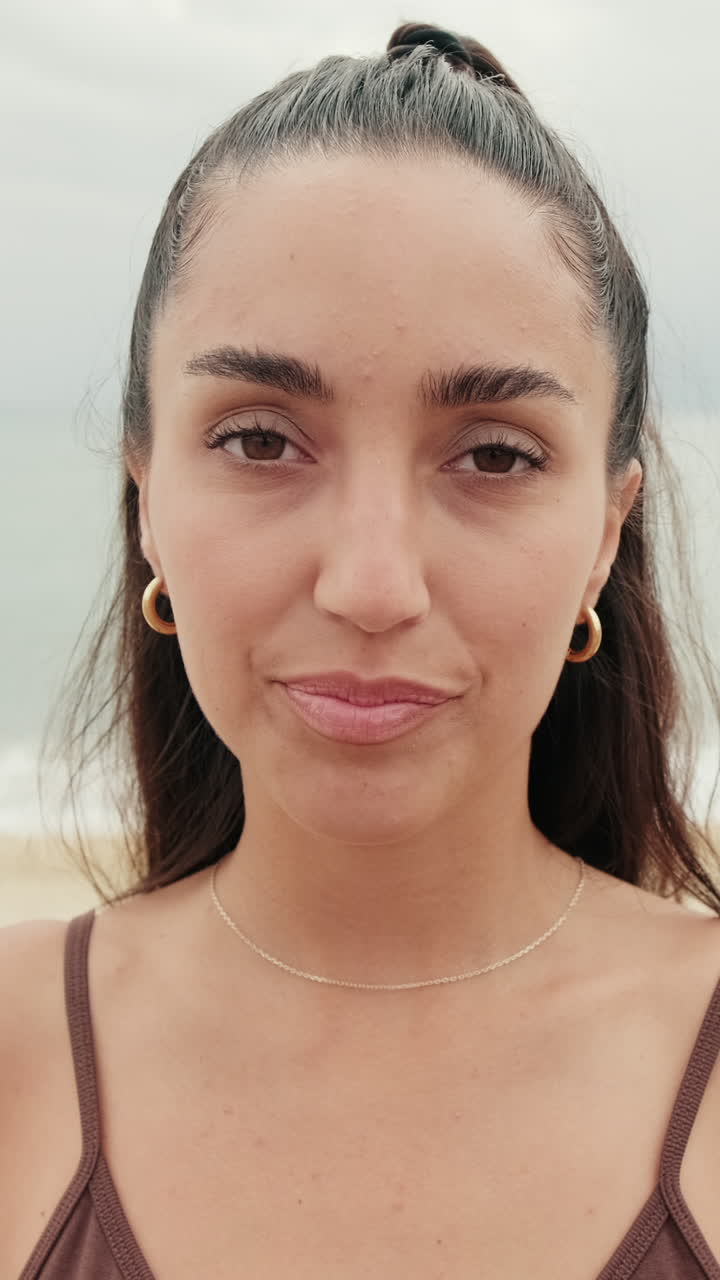 Woman on Beach with Cloudy Sky