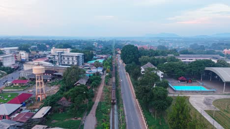aerial view of train passing through a town