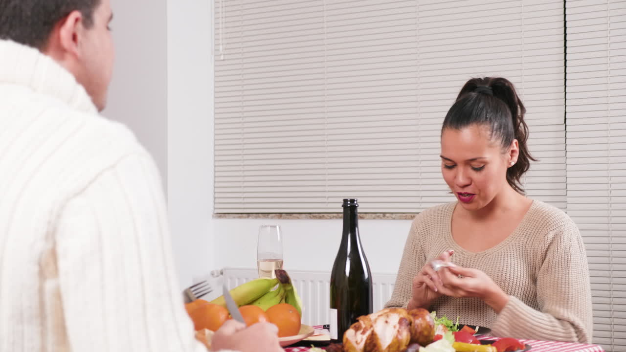 Couple having dinner at Christmas