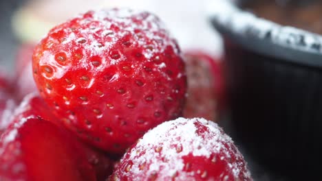 close-up of strawberries dusted with powdered sugar
