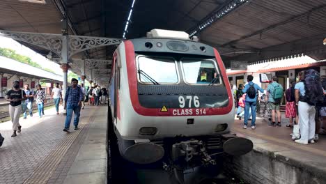 sri lankan commuter train at a railway station
