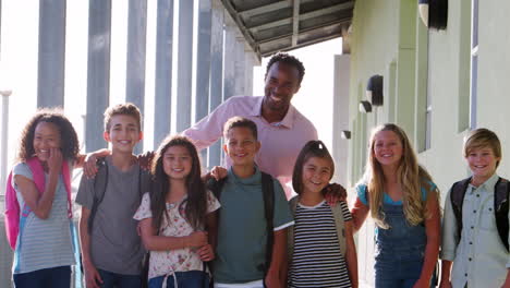 a group of schoolchildren with their teacher, outdoors