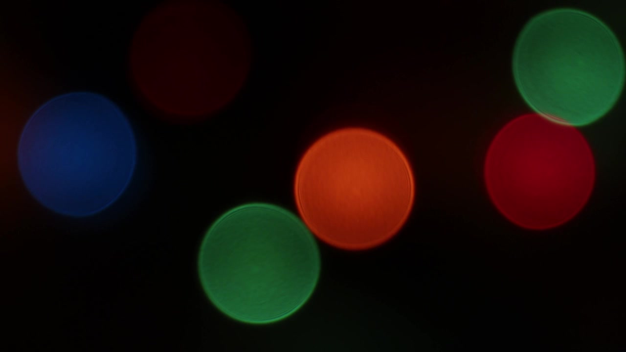 blinking defocused christmas lights in dark background