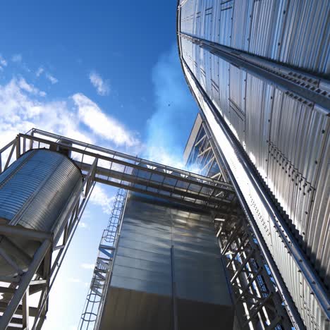 modern complex for agribusiness. large storage container. industrial equipment for drying grains. metal construction for storing crop. industry outdoors