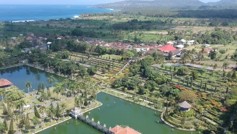 aerial pan up from royal palace surrounded by moat, bali, indonesia