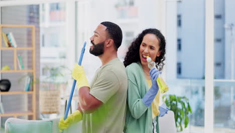 Cleaning,-home-and-couple-singing-in-living-room