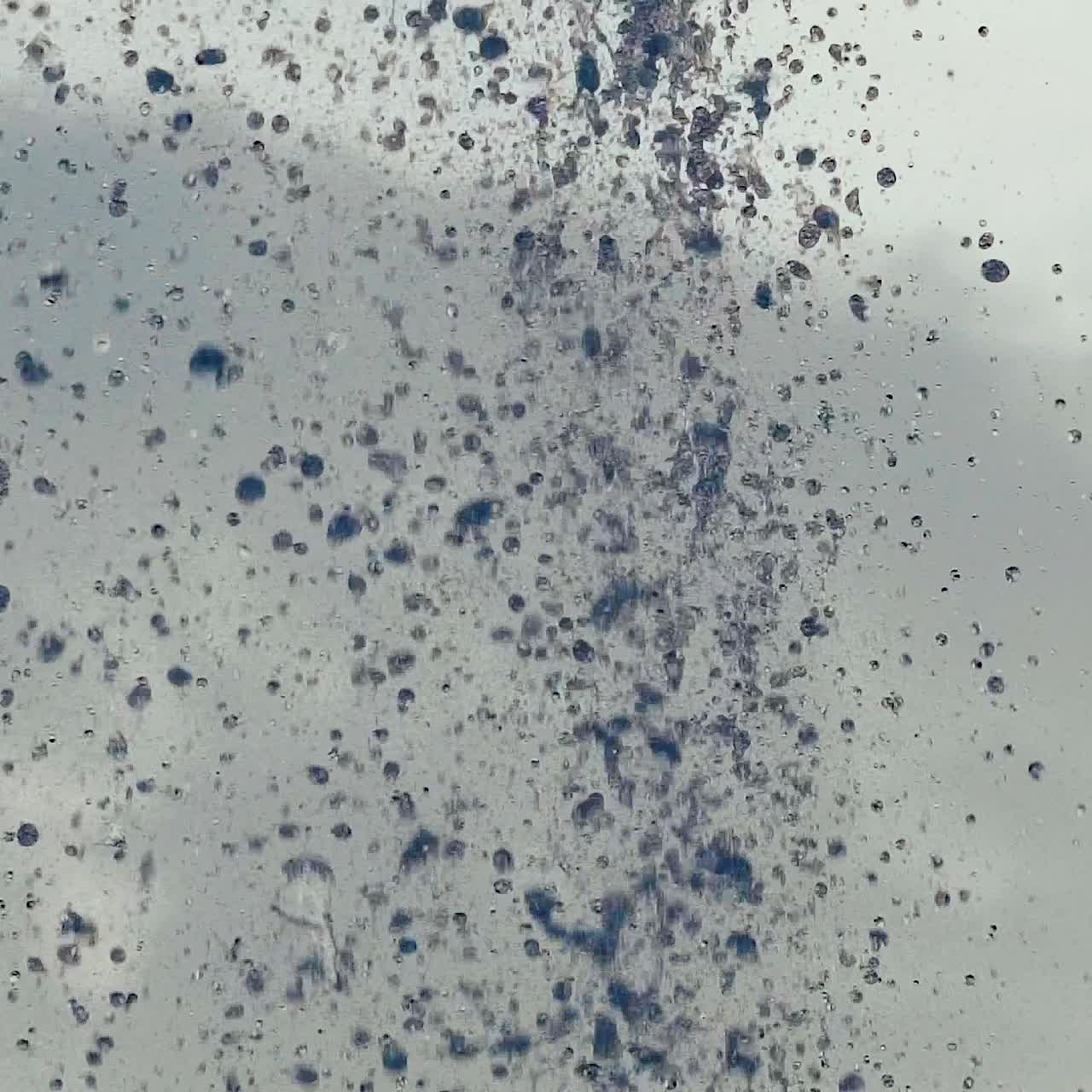 Water droplets. Streams of fountain close-up. Slow motion