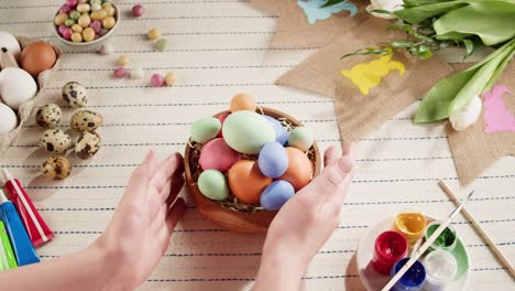 happy easter holiday. colored eggs top view. preparing for easter, painting and decorating eggs. christian celebration, family traditions.