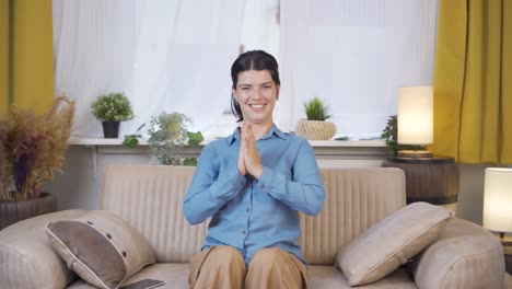 Young-woman-giving-greeting-and-applause-to-camera.