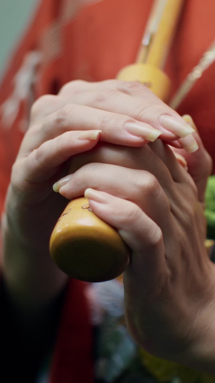 Woman holding an umbrella handle