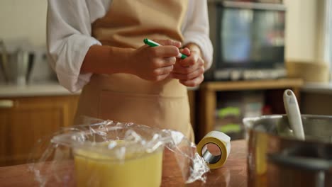 woman baking a cake in a kitchen