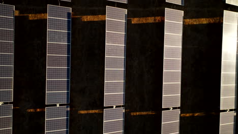 closeup top down riser over zero emissions pv panels on solar park