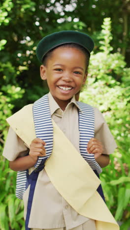 vertical video of portrait of happy african american girl in garden