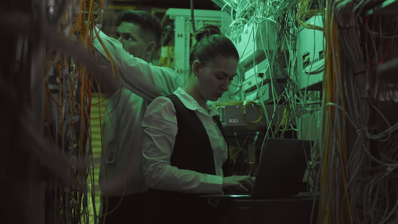 IT technicians working in server room