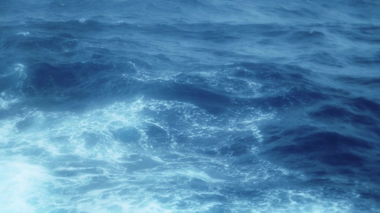 Oceano agitato e onde in mare, sfondo di acqua blu mossa e mareggiata durante una traversata in nave da crociera che attraversa il Passaggio di Drake verso l'Antartide, attraverso l'acqua fino alla Penisola Antartica da Ushuaia.