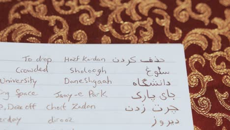 opening notebook to reveal persian language learning