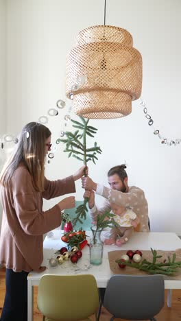 family preparing for christmas decorations