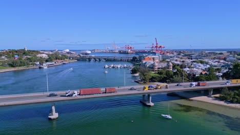 aerial view of semi trailer trucks crossing stirling bridge in fremantle, perth, western australia