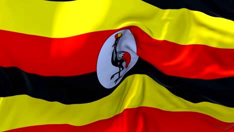 bandera de uganda ondeando en el viento animación en cámara lenta. 4k textura de tela realista bandera soplando suavemente en un día de viento fondo de bucle continuo sin costuras.