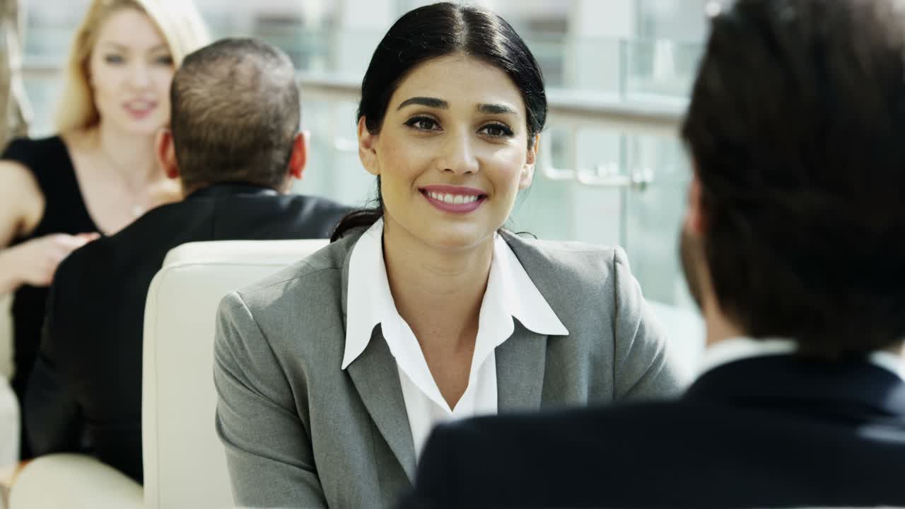 Middle Eastern and Western business executives meeting together