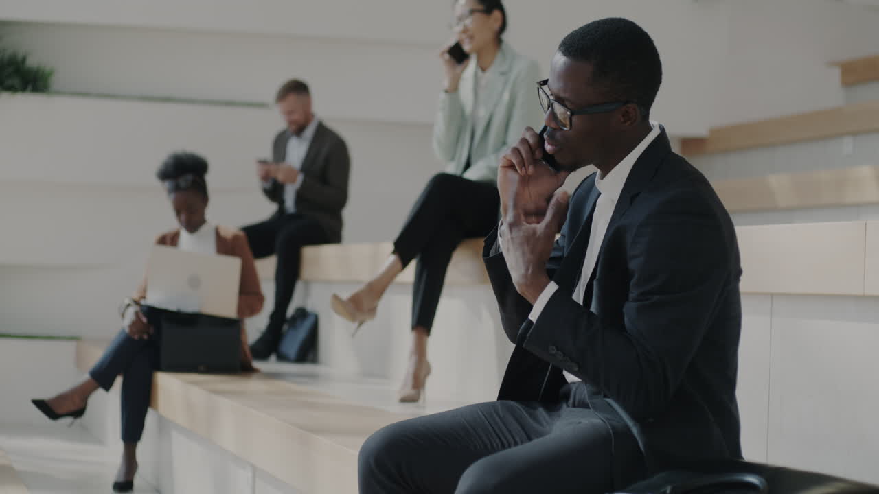 Business People Waiting in Modern Office