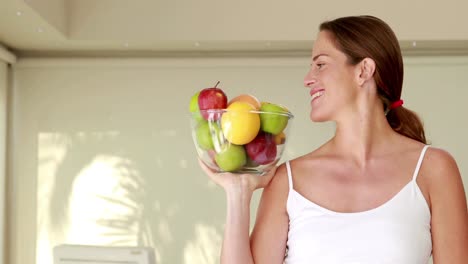 Pregnant-woman-holding-fruit-bowl