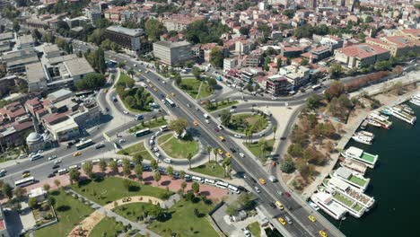 car traffic intersection with yellow taxi cabs in istanbul on bosphorus, scenic aerial birds eye overhead view