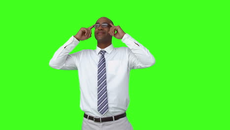 businessman with his hands on glasses