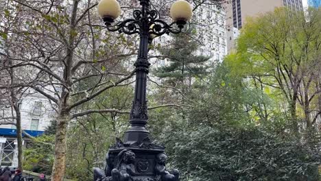 ornate central park street light, looking up to plaza hotel, manhattan, new york city