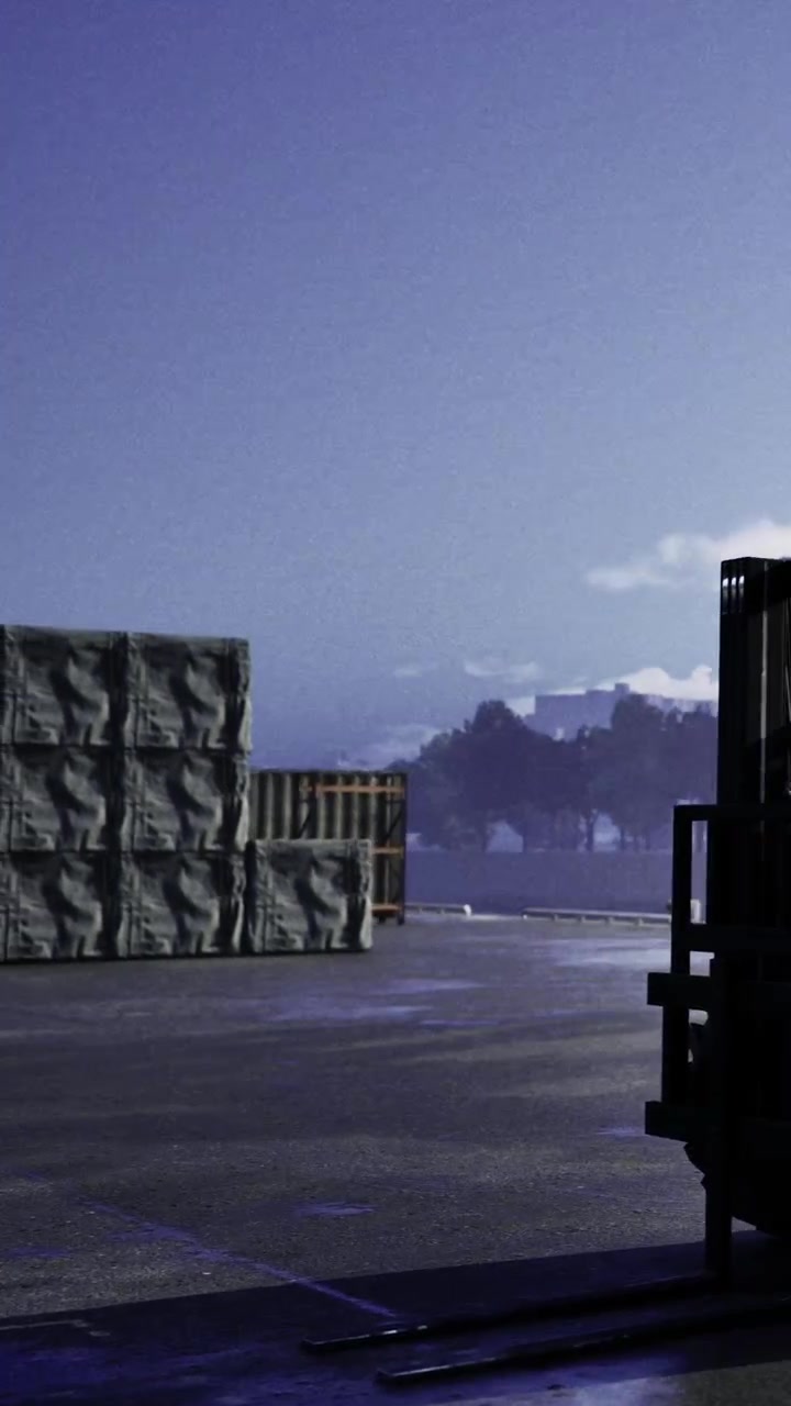 Pallets are stacked on the road near a waterfront