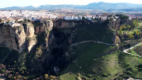 aerial dolly towards luxury homes and apartments on the beautiful cliffs of ronda spain