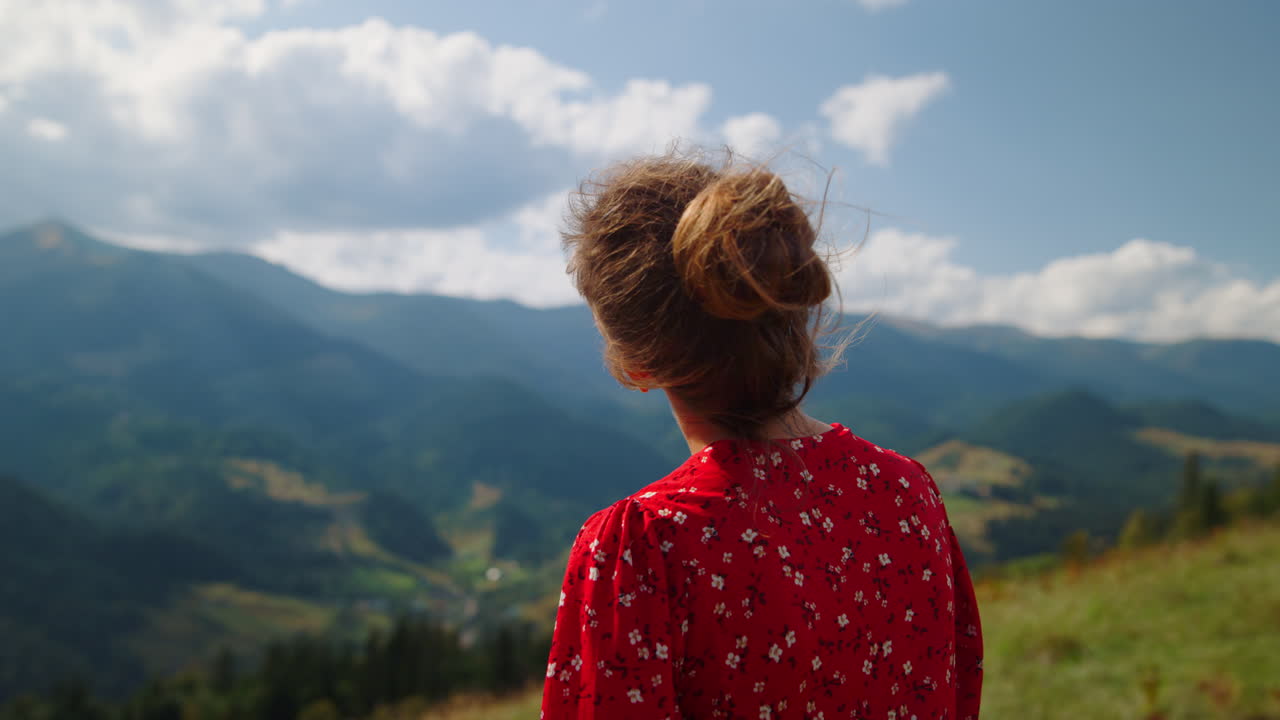 Tranquil girl standing hill admiring mountain view close up. Woman enjoy summer.