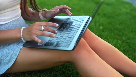 woman using laptop outdoors