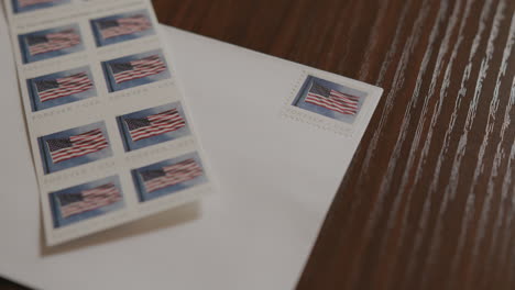 close up pan of an envelope and stamps