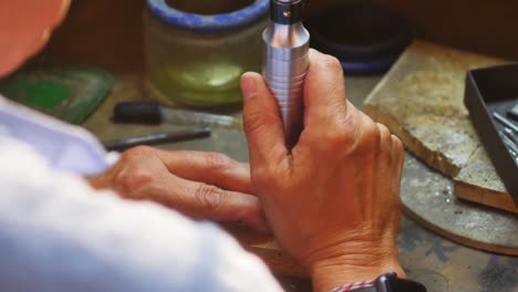 Craftswoman-working-in-workshop