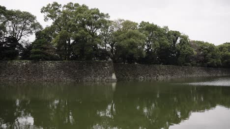 imperial palace moat and city buildings of tokyo, japan 4k