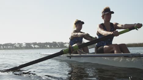 female rowers training on a river