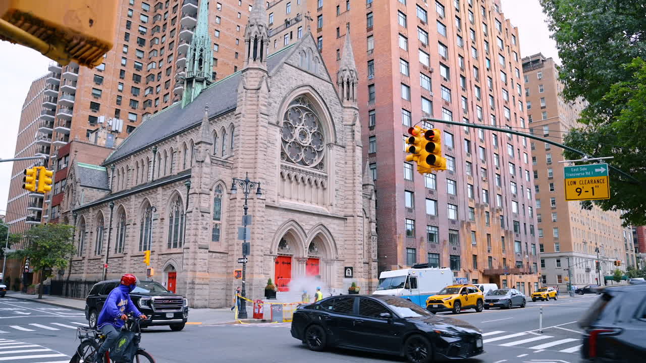 New York, USA, 4 August 2025: Historic church surrounded by modern buildings in Manhattan