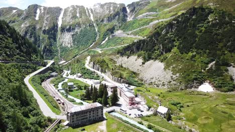 aerial view of a winding mountain road in the alps