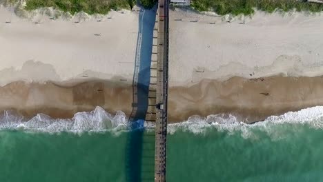 top down aerial view of the bogue inlet ocean pier on a sunny day