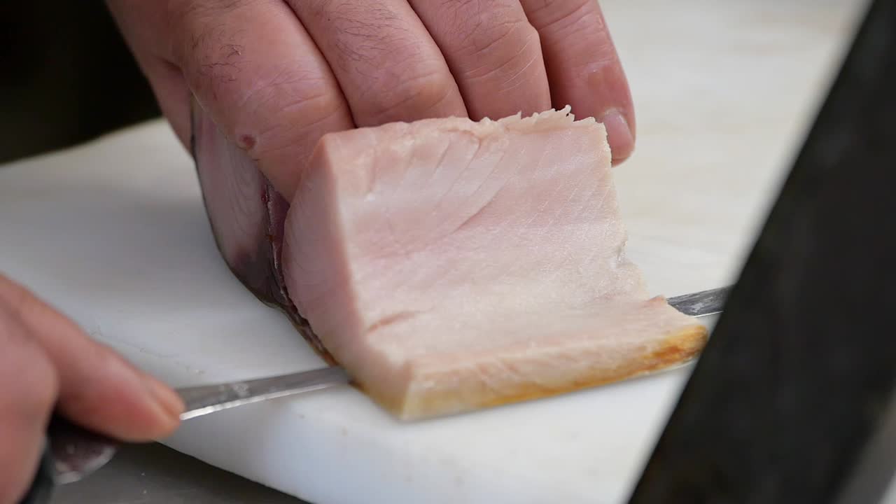 Chef preparing tuna sashimi