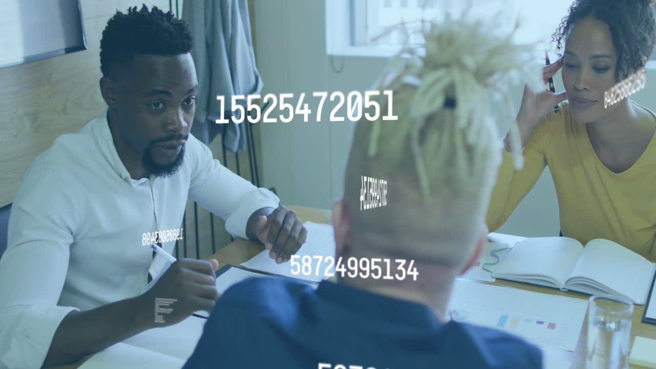 Animation of numbers changing over diverse business people using laptop