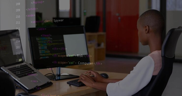 Woman coder typing and mousing at desk in office, security overlay intensifying for analysis